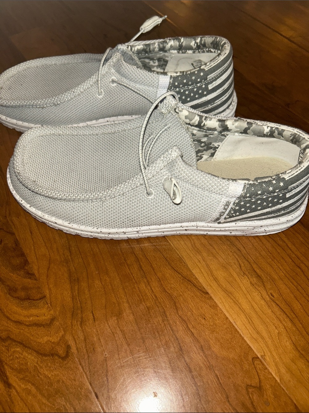 Hey Dudes Men's Casual Light Gray Slip-On Loafers with Flag Heel Accent